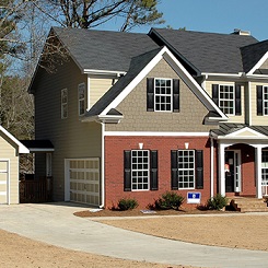 A two-story tri-toned home exterior photo